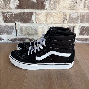 Vans Sk8-Hi hi-top sneakers in black and white suede